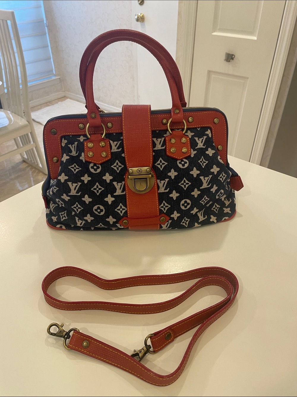 Designer blue denim monogram with red trim and handles O/S
